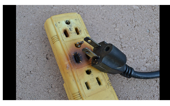 Dangerous burnt plastic extension cord caused by overloading